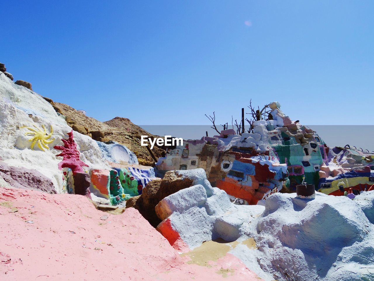 Panoramic view of mountains against clear blue sky