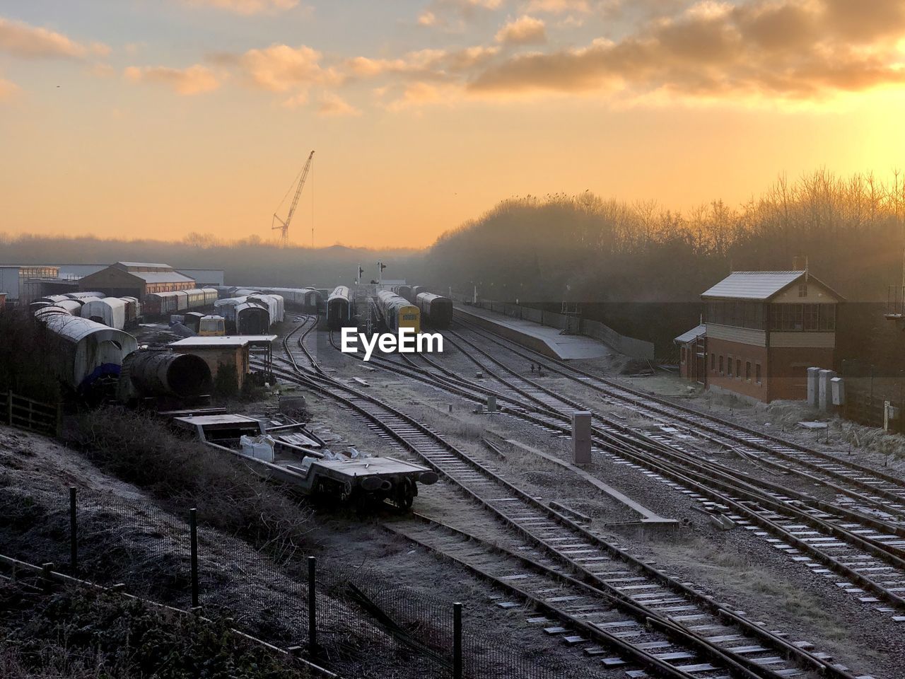 High angle view of railroad tracks against sky during sunset