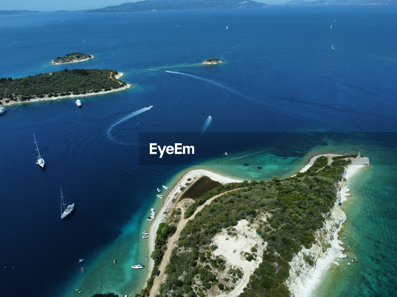 water, sea, aerial view, aerial photography, coast, land, beach, transportation, nature, scenics - nature, ocean, coastline, environment, nautical vessel, island, beauty in nature, travel, blue, high angle view, travel destinations, landscape, bay, mode of transportation, no people, outdoors, archipelago, horizon, day, architecture, spit, islet, sky, city, terrain, sports, motion, tourism, bay of water, holiday, vacation, air vehicle, tranquility, trip, airplane, flying