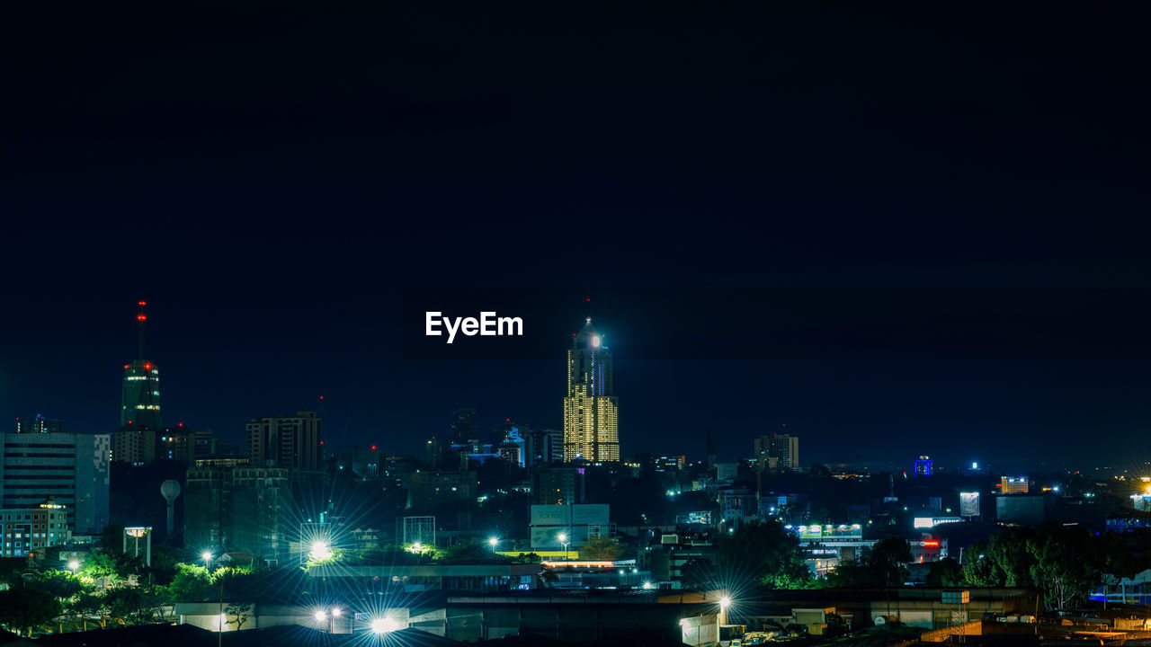 Illuminated buildings in city at night