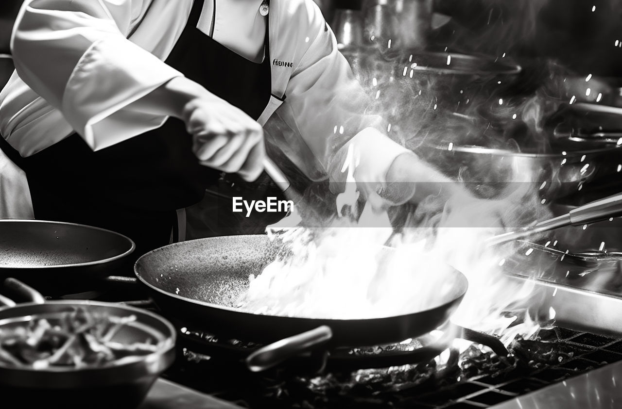 midsection of chef preparing food