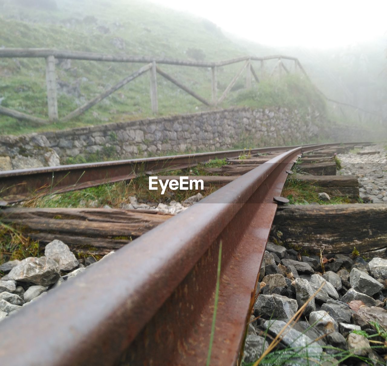 Close-up of railroad track against sky