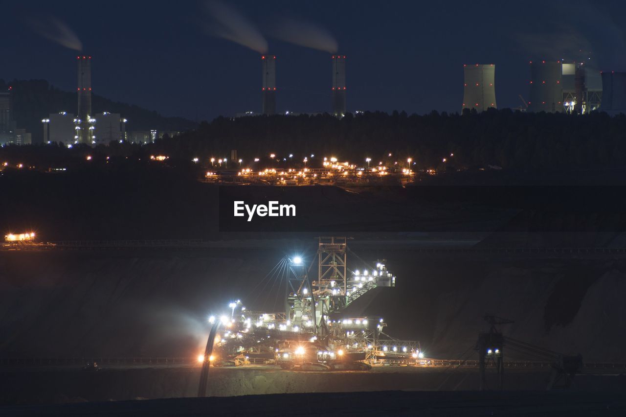 Industrial buildings lit up at night