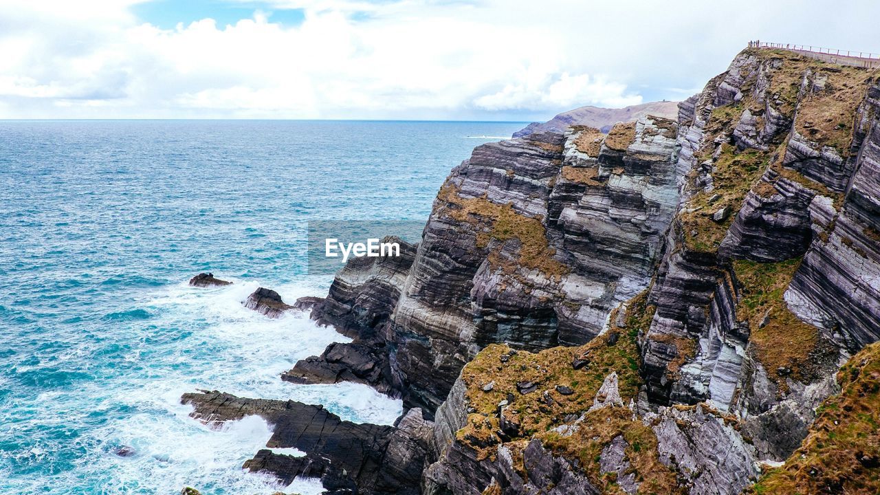 Scenic view of sea against cloudy sky