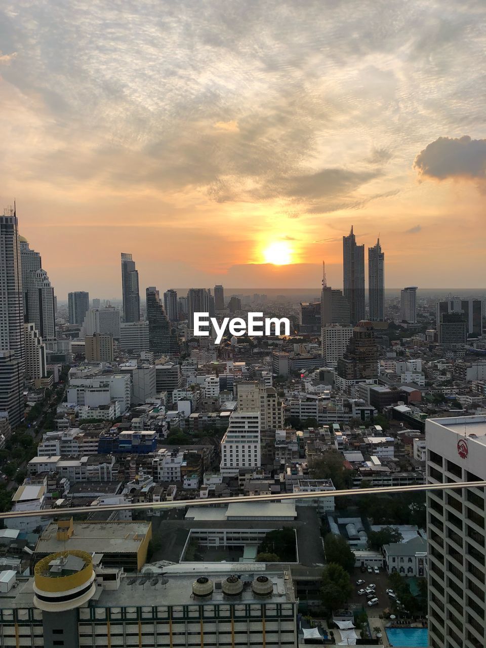 Cityscape against sky during sunset