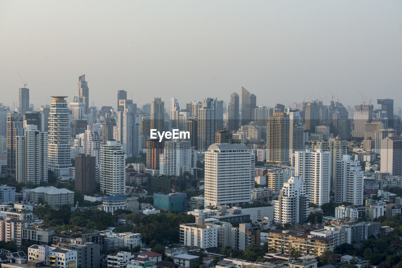 AERIAL VIEW OF CITY BUILDINGS AGAINST SKY