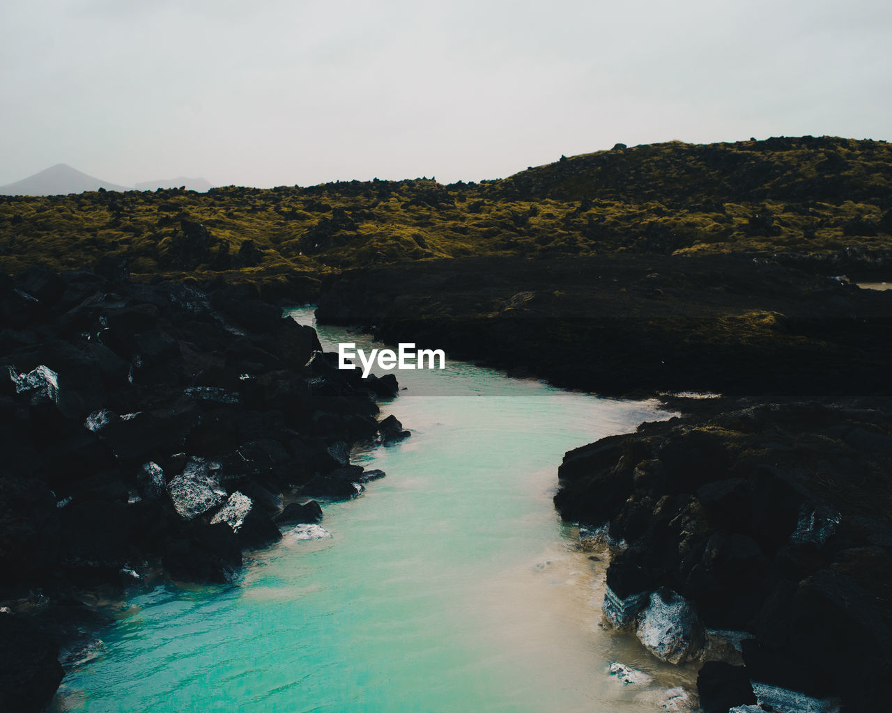 Scenic view of sea and rocks against sky