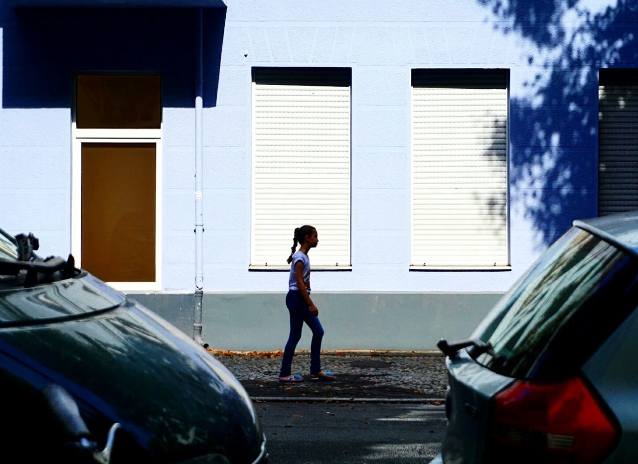 MAN STANDING ON WALL