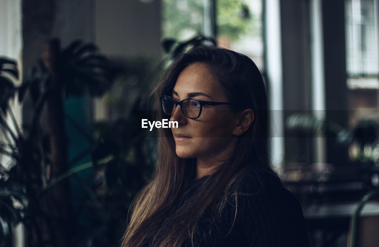 Close-up of young woman wearing eyeglasses