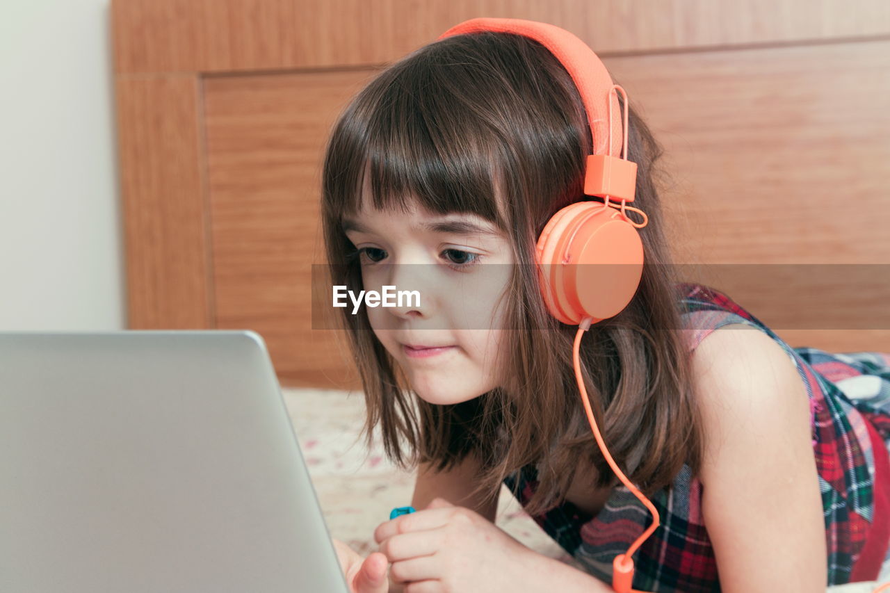 close-up of young woman using digital tablet