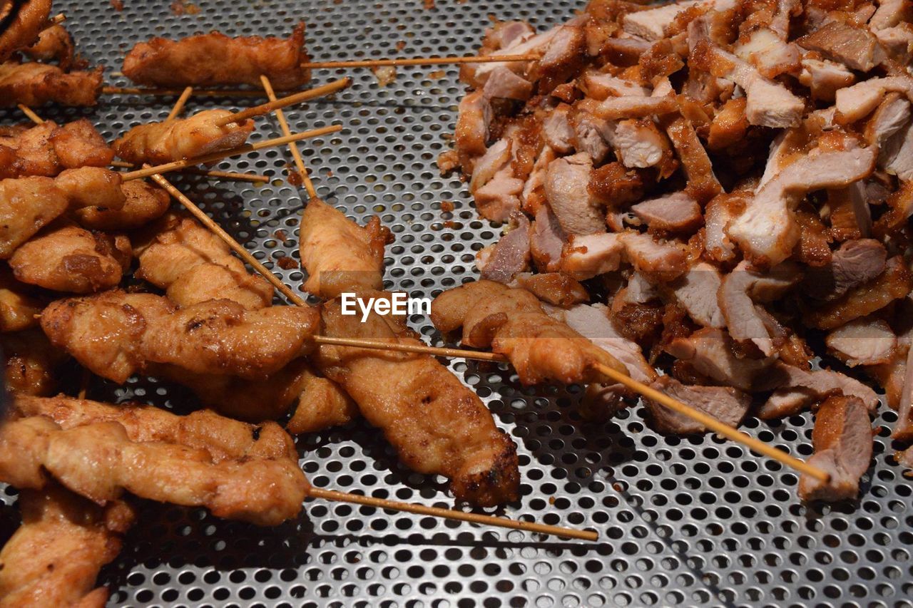 CLOSE-UP OF MEAT ON BARBECUE