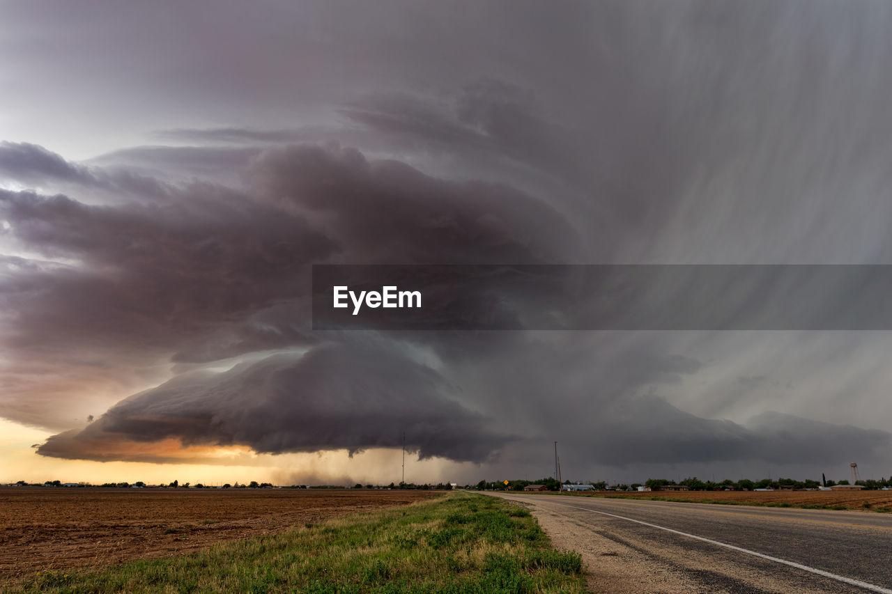 Storm clouds over field