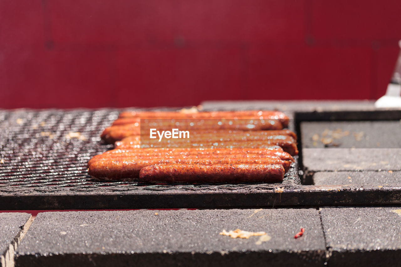 Close-up of sausages on barbecue grill