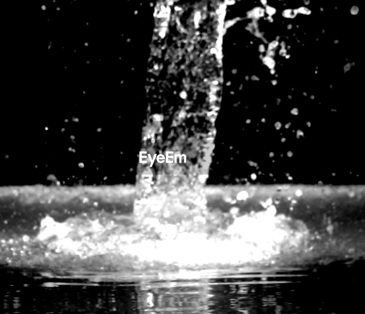 CLOSE-UP OF WATER DROPS ON GLASS