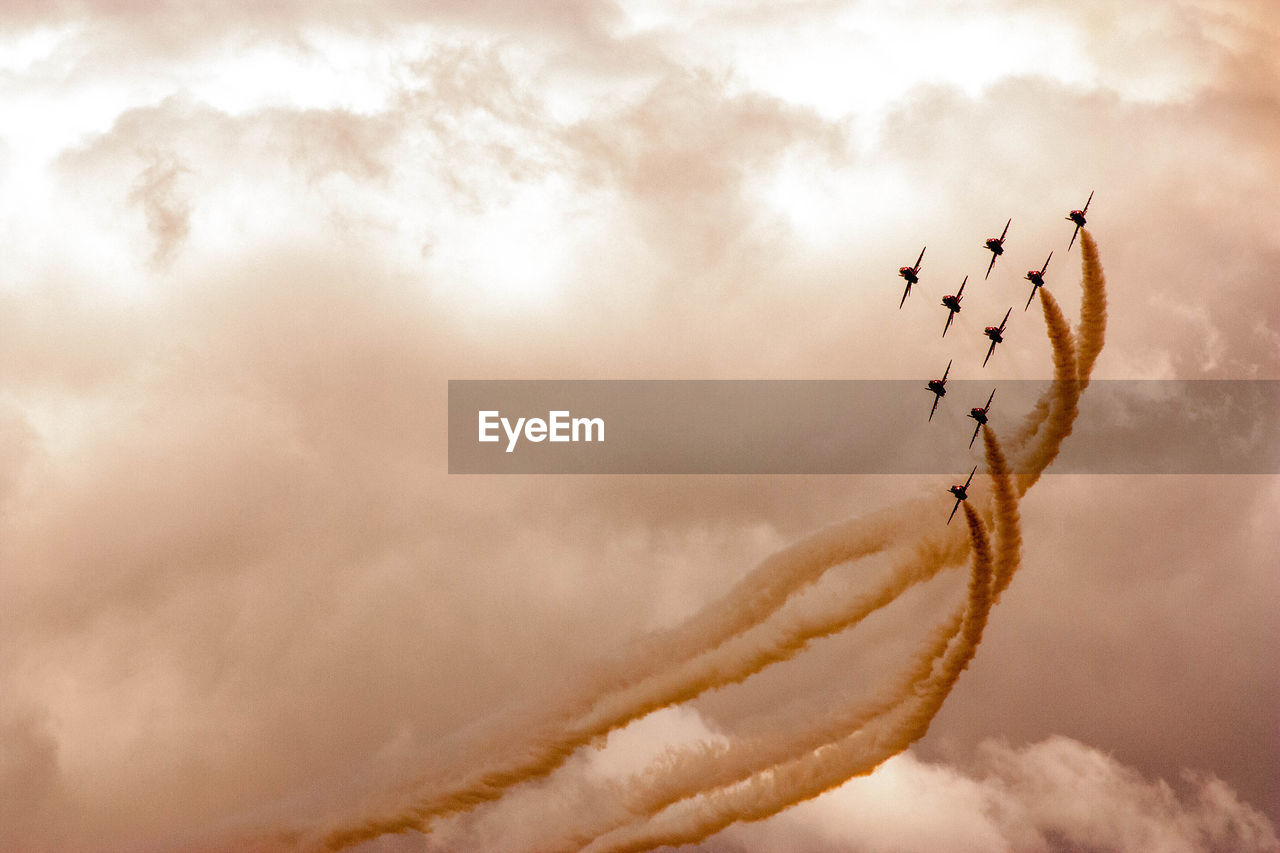 LOW ANGLE VIEW OF AIRPLANE FLYING IN SKY