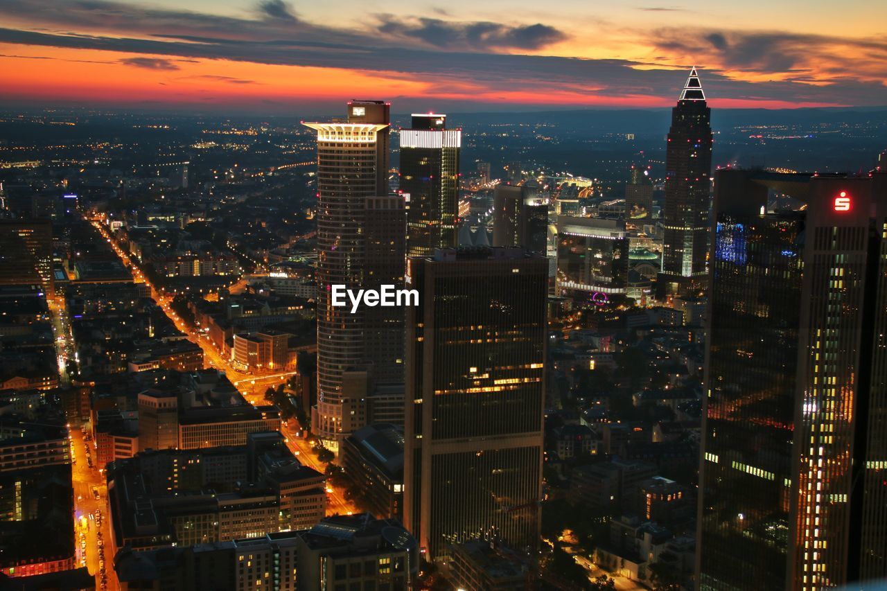 Aerial view of illuminated city at night