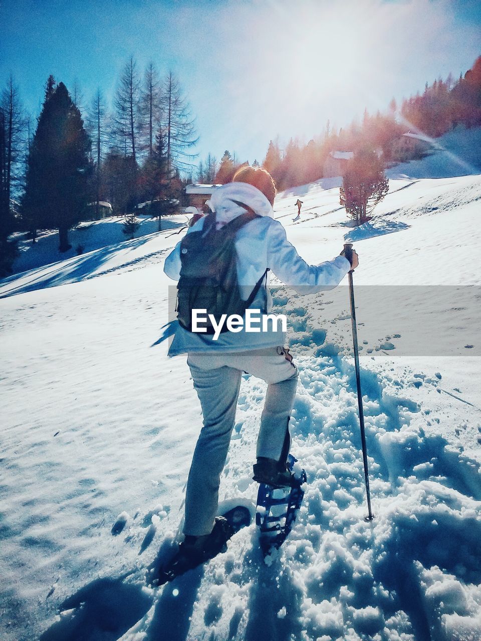 Person standing on snow covered field