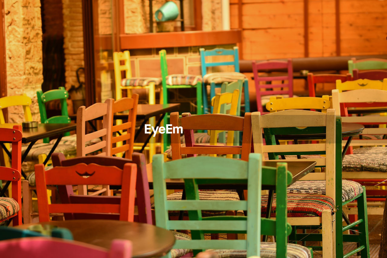 Empty chairs and tables in store
