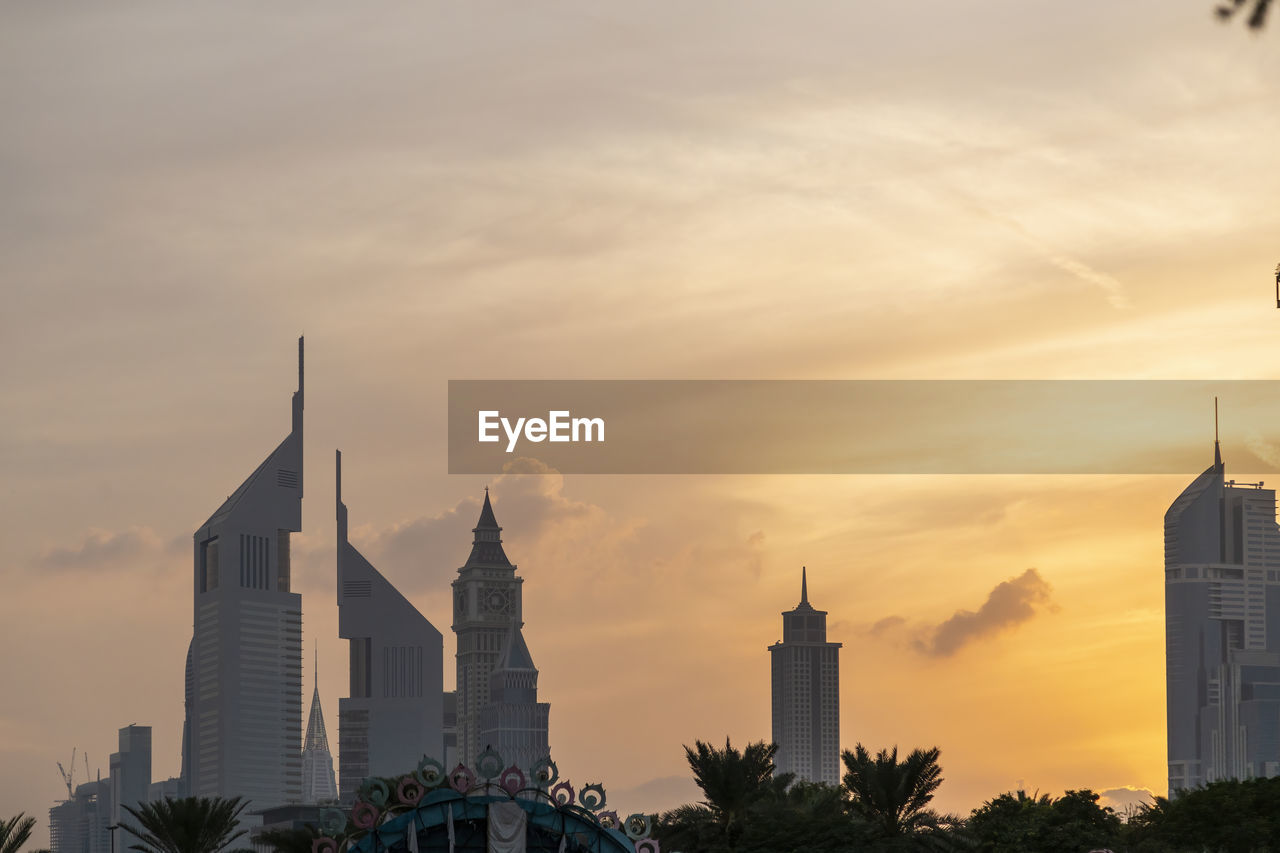 VIEW OF BUILDINGS AGAINST SKY DURING SUNSET