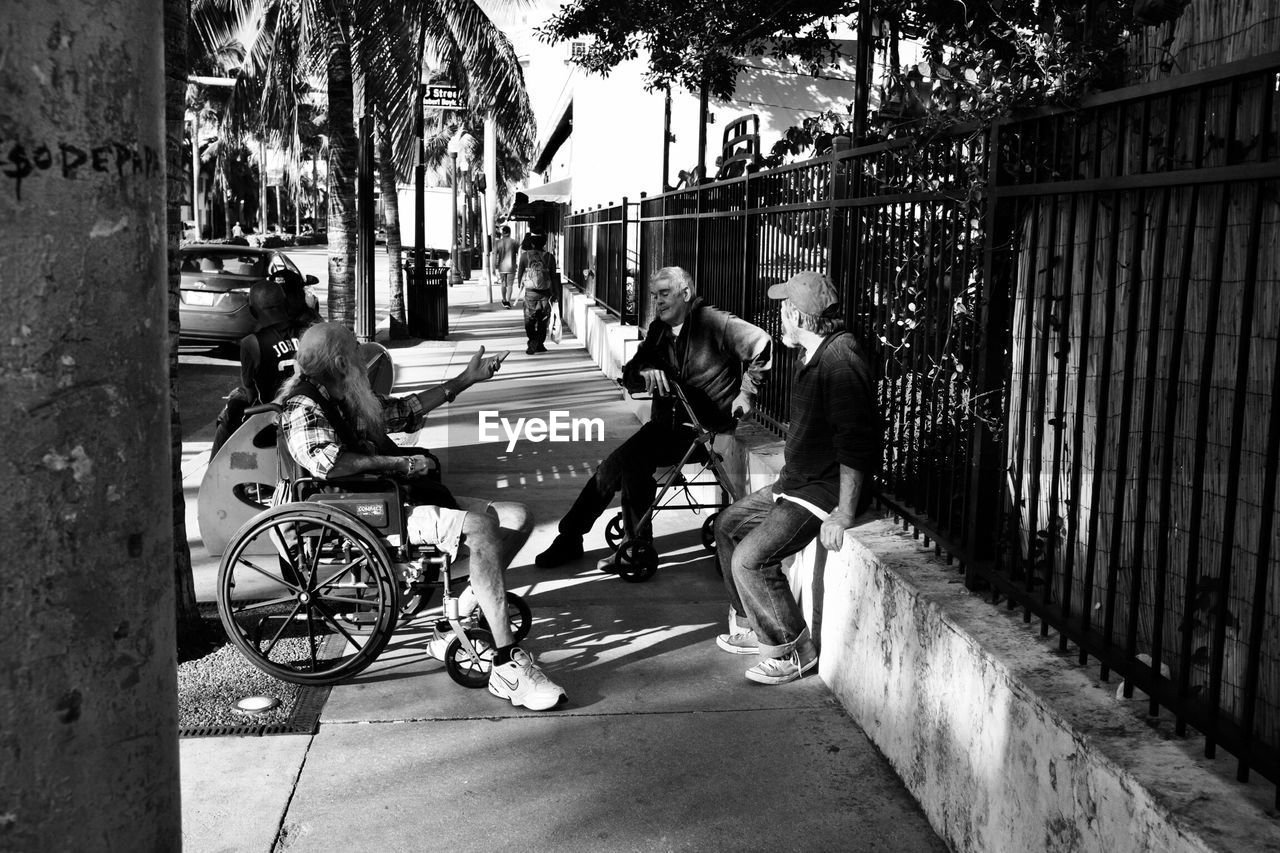 MAN RIDING BICYCLE ON CITY