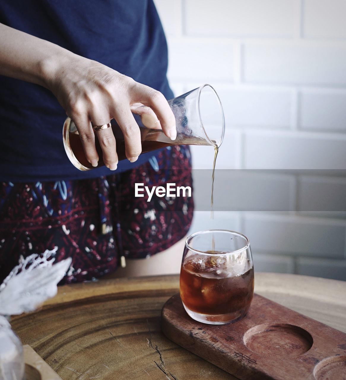 Midsection of woman holding drink