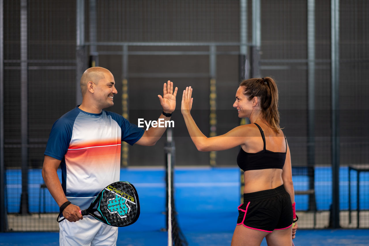 Portrait of handshake of two padel tennis players