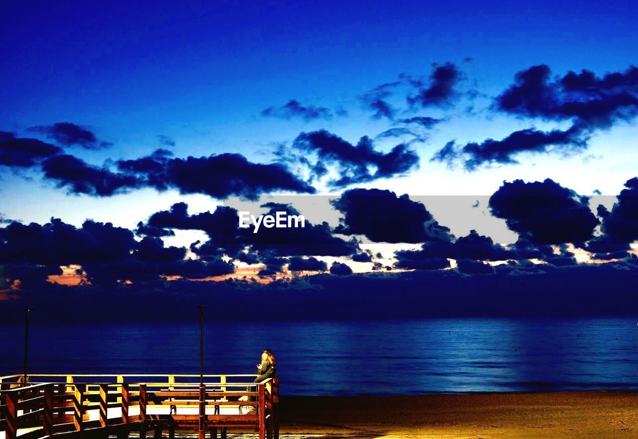 PANORAMIC VIEW OF SEA AGAINST SKY AT NIGHT
