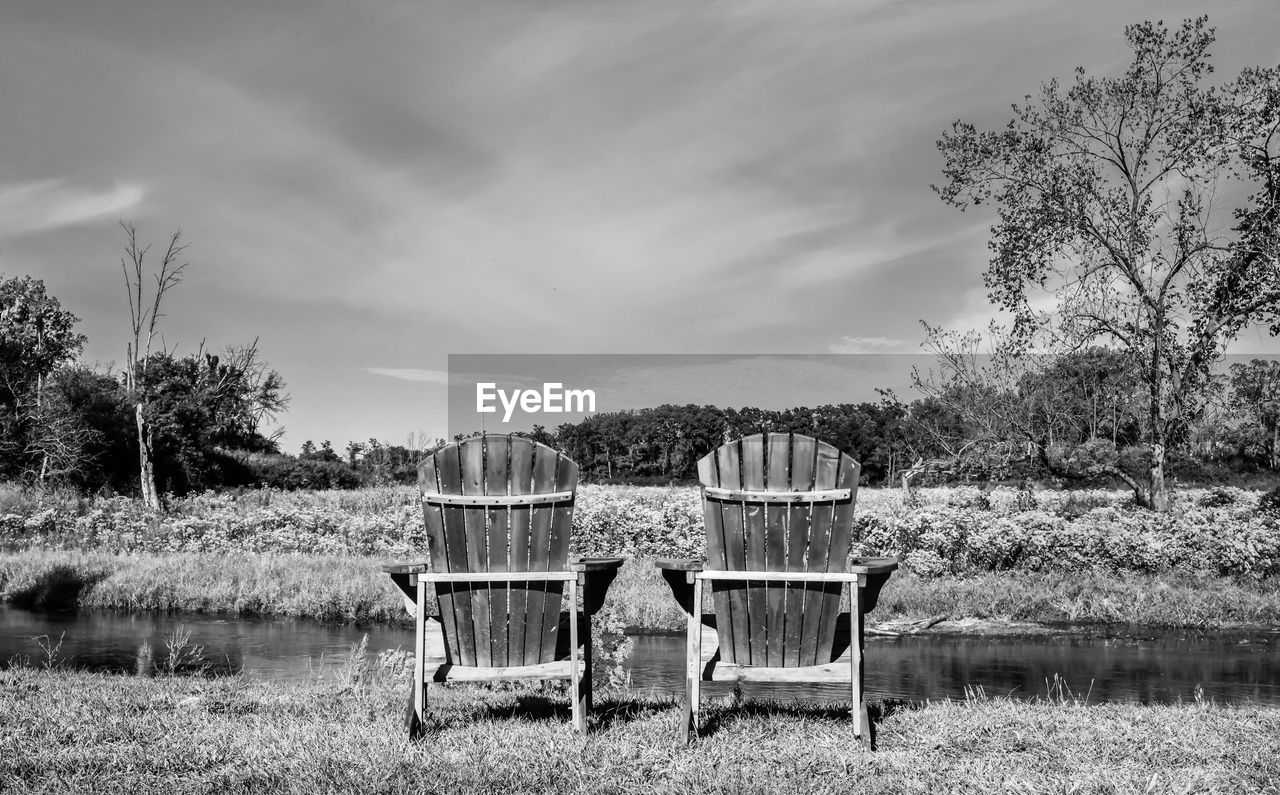 CHAIR ON FIELD AGAINST SKY