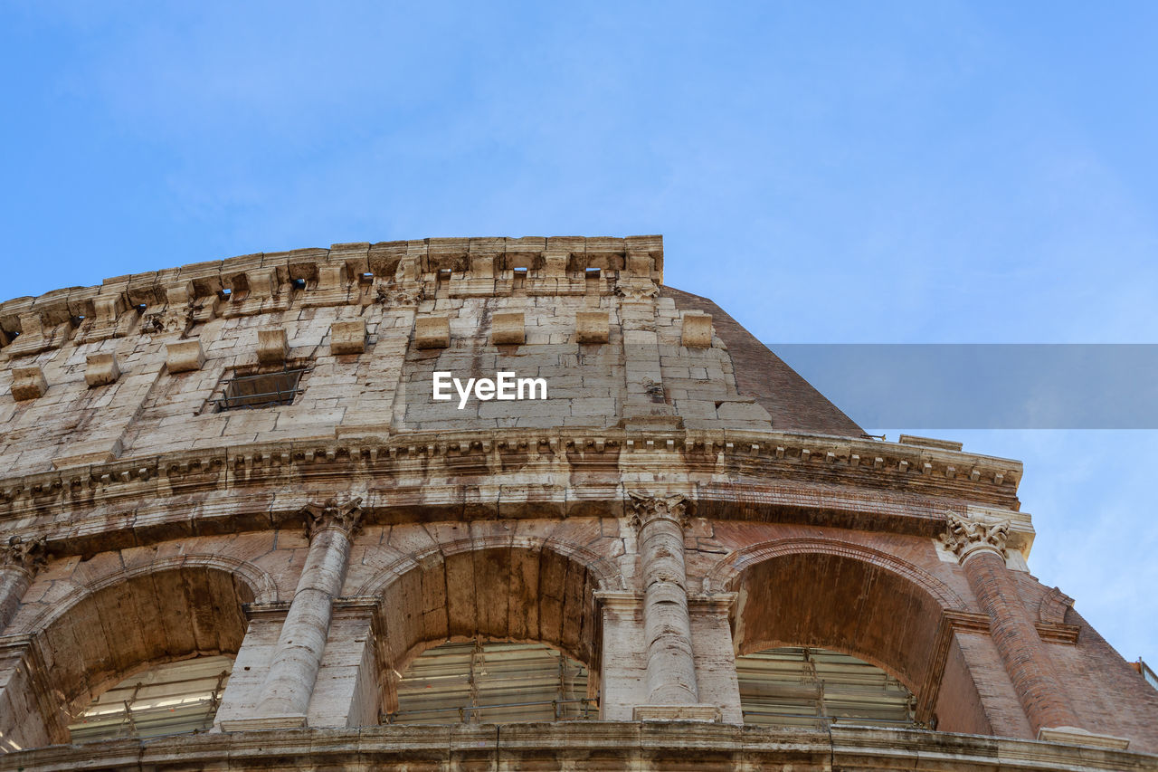 Low angle view colosseum  against sky