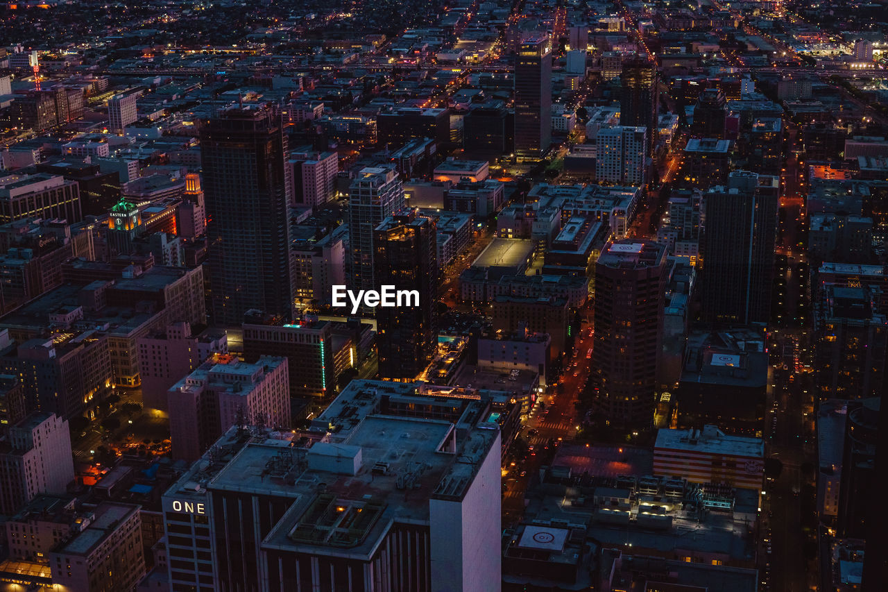 Aerial view of city lit up at night