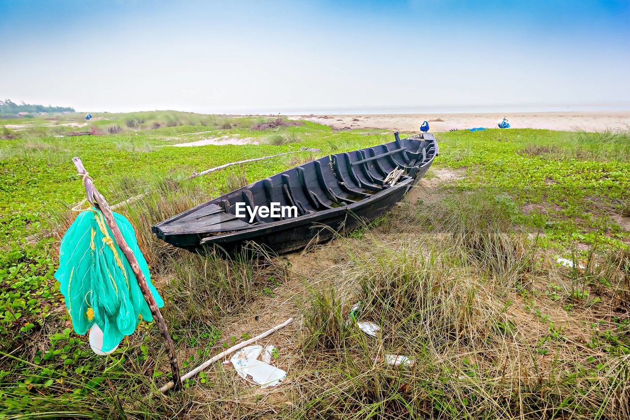 High angle view of abandoned fishing boat on land