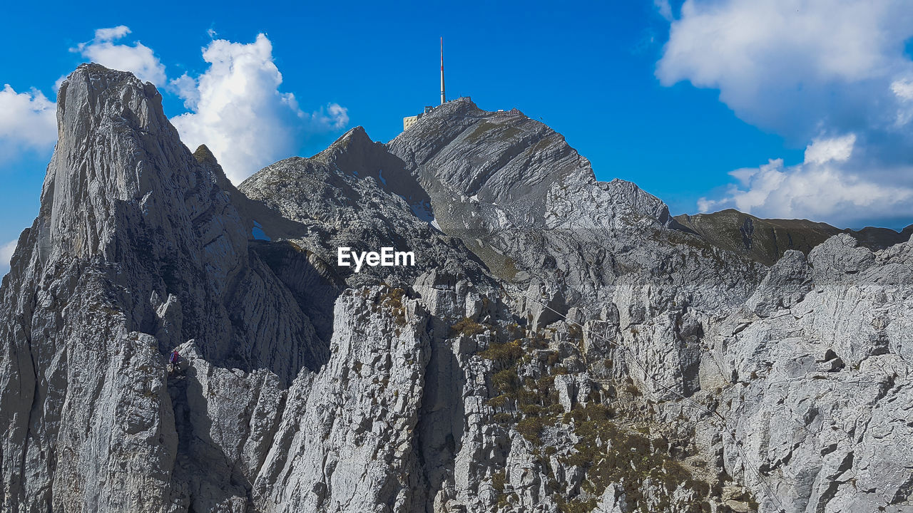 Low angle view of rocky mountains against sky