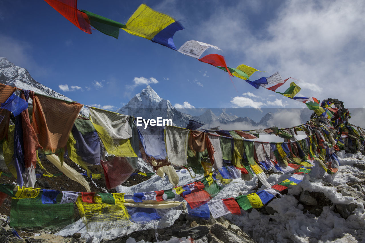 Prayer flags in front of ama dablam in nepal's khumbu valley.