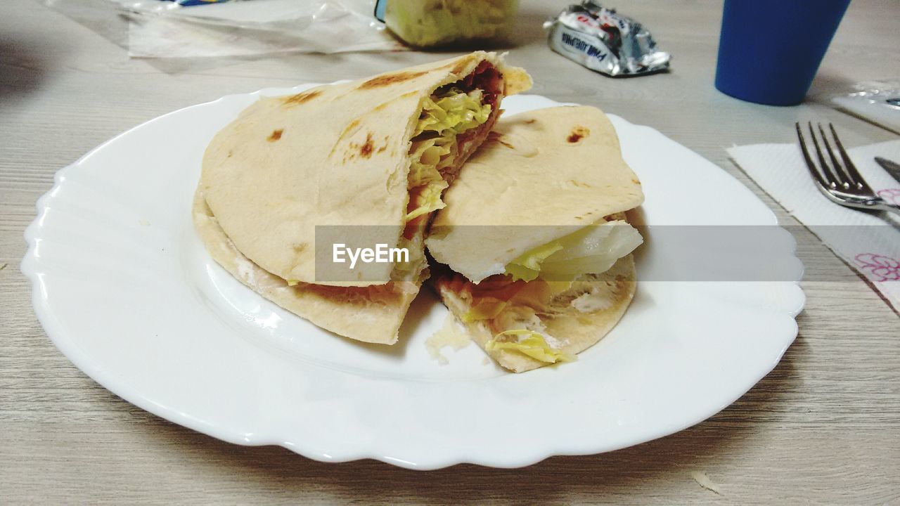 HIGH ANGLE VIEW OF SERVING FOOD SERVED ON TABLE