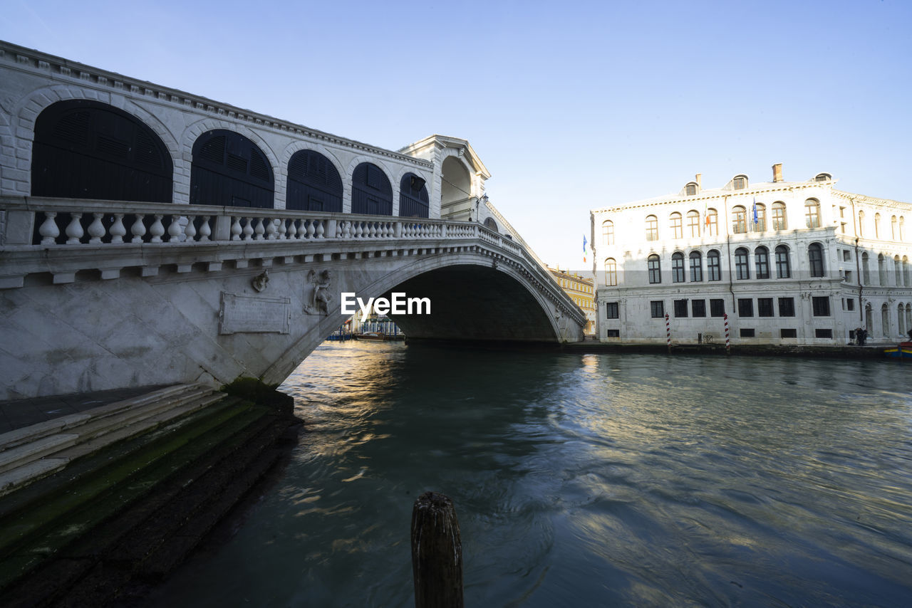 ARCH BRIDGE OVER RIVER AGAINST SKY