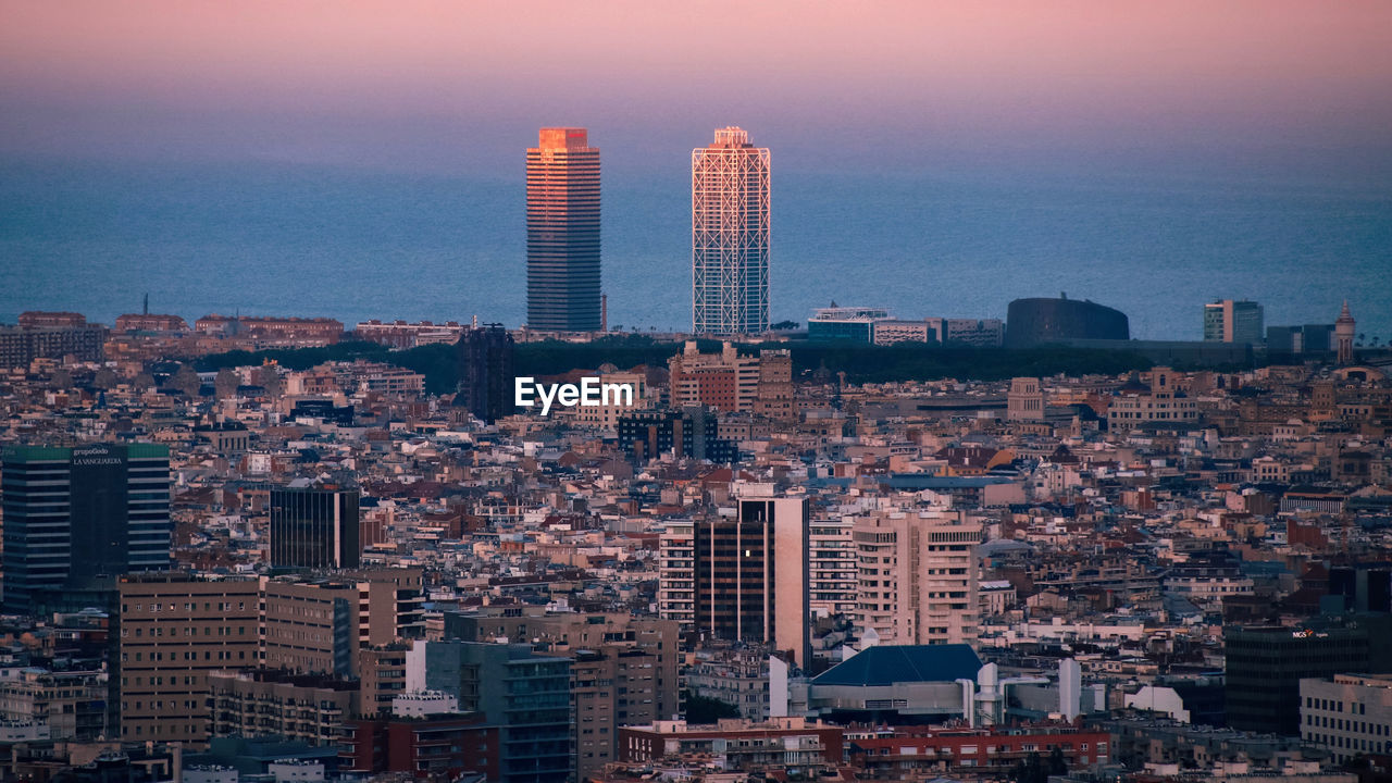 Modern buildings in city against sky