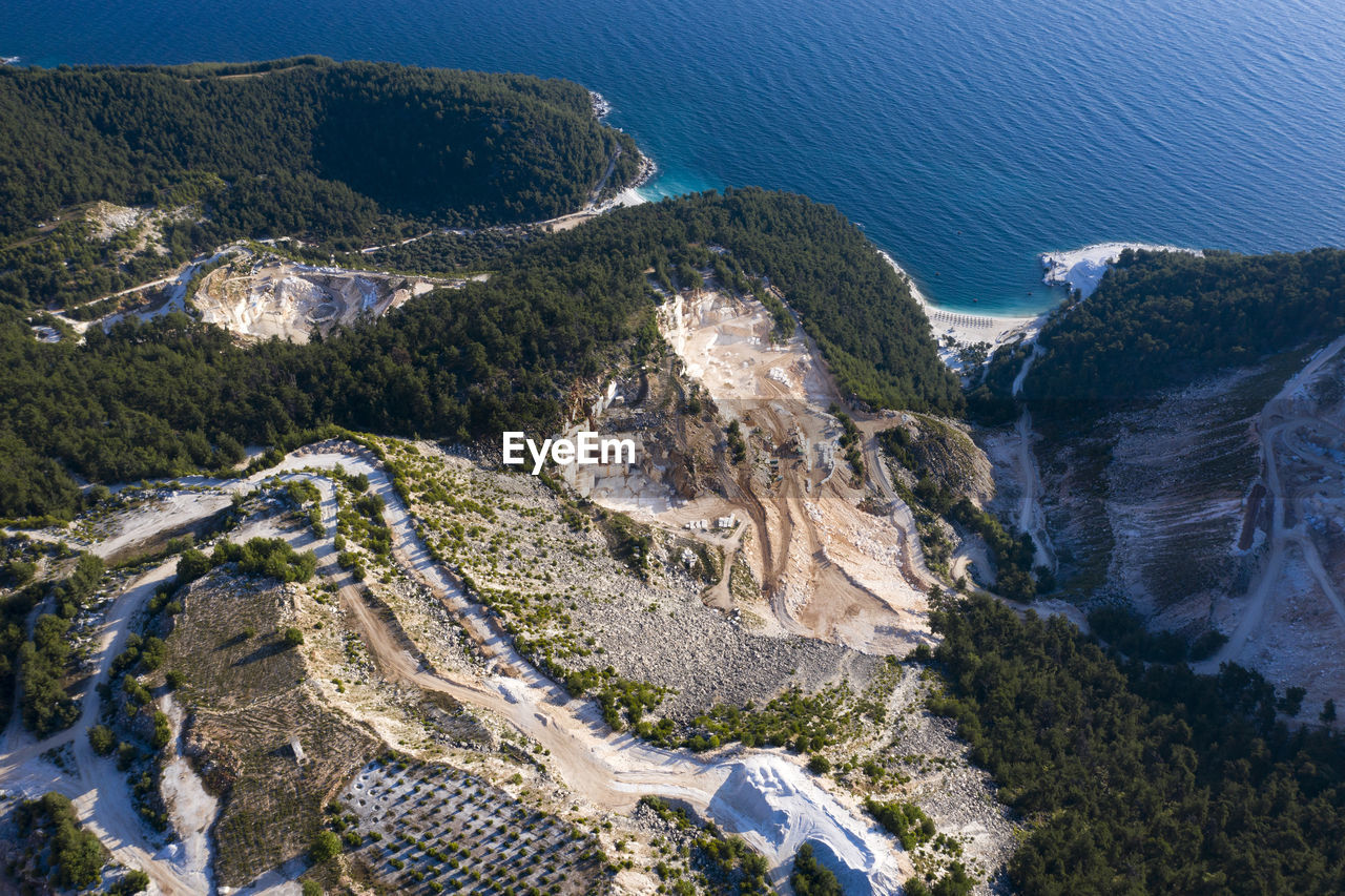 Aerial view of landscape by sea