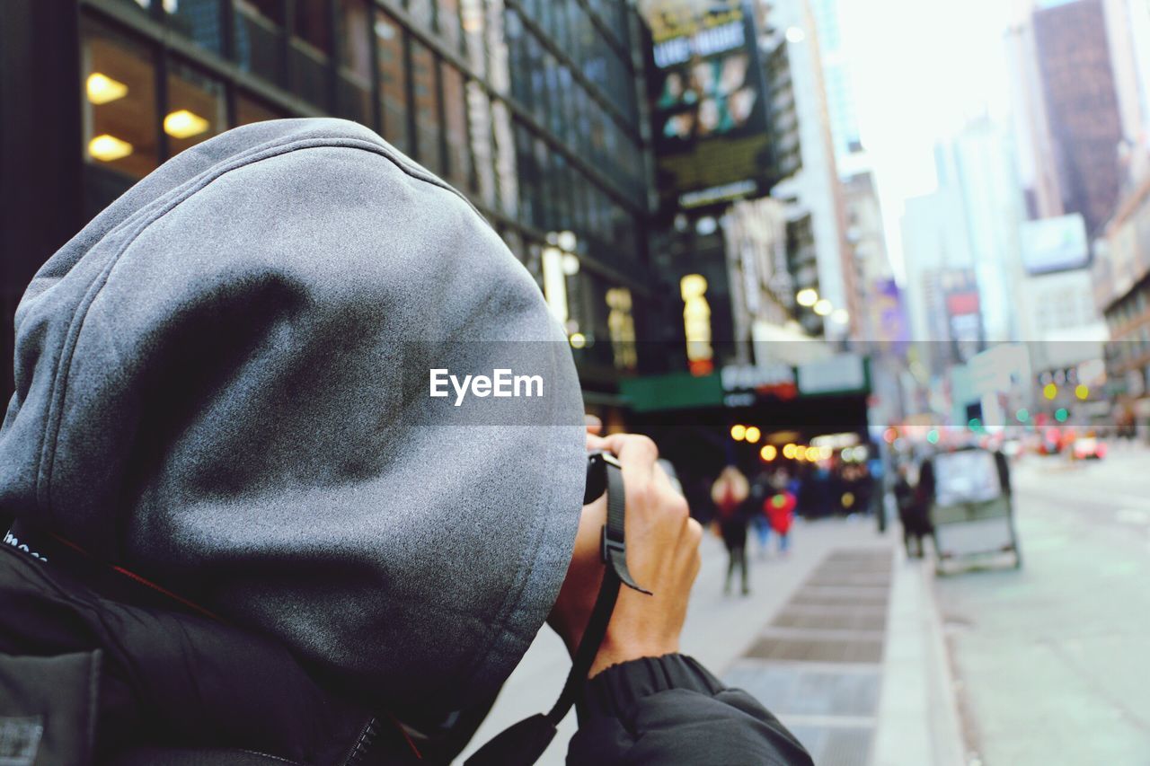 CLOSE-UP OF MAN PHOTOGRAPHING WITH MOBILE PHONE