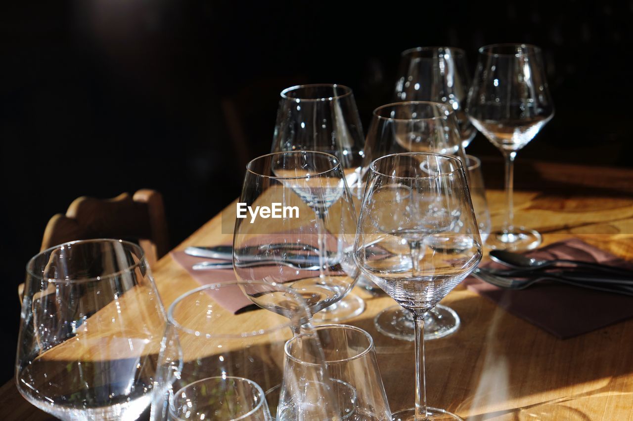 Wineglasses arranged on table at restaurant