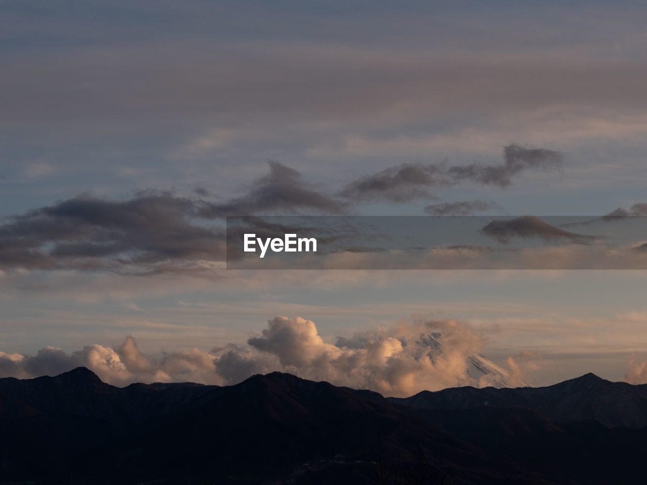 Scenic view of mountains against sky during sunset