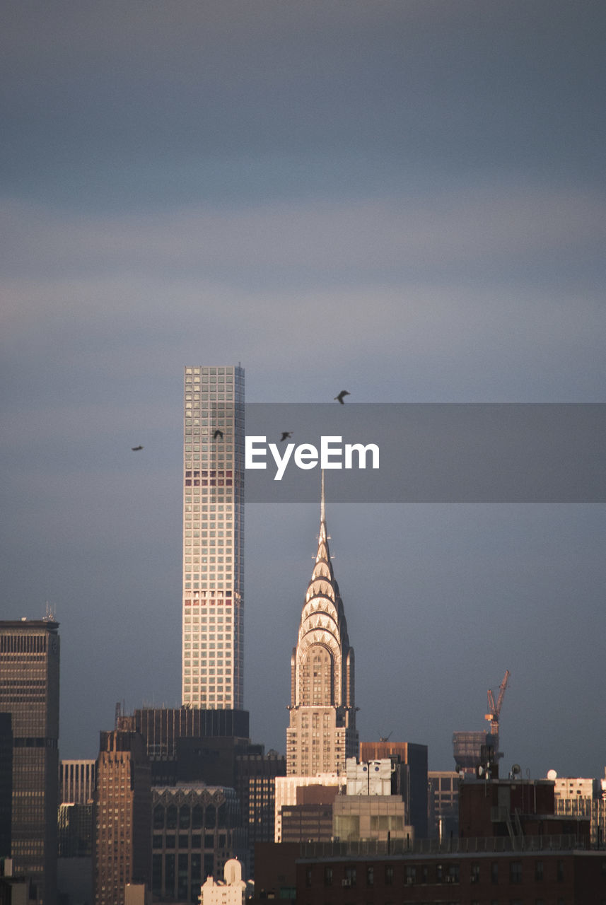 Modern buildings in city against sky