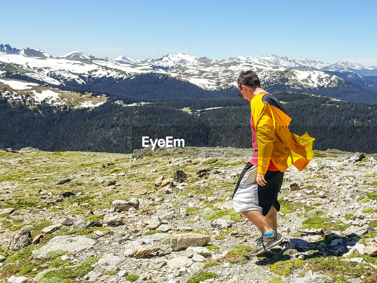 View of man standing on mountain landscape