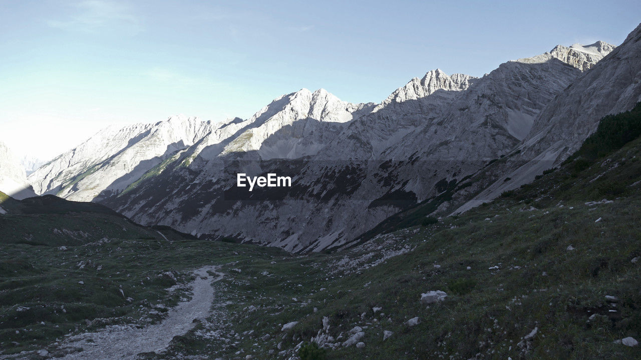 mountain, scenics - nature, environment, landscape, mountain range, snow, beauty in nature, sky, cold temperature, nature, winter, mountain pass, ridge, wilderness, snowcapped mountain, land, travel destinations, no people, travel, cirque, adventure, cloud, mountain peak, activity, outdoors, non-urban scene, rock, day, tranquility, tranquil scene, moraine, leisure activity, tourism, summit, plateau, ice, valley, plant, glacier