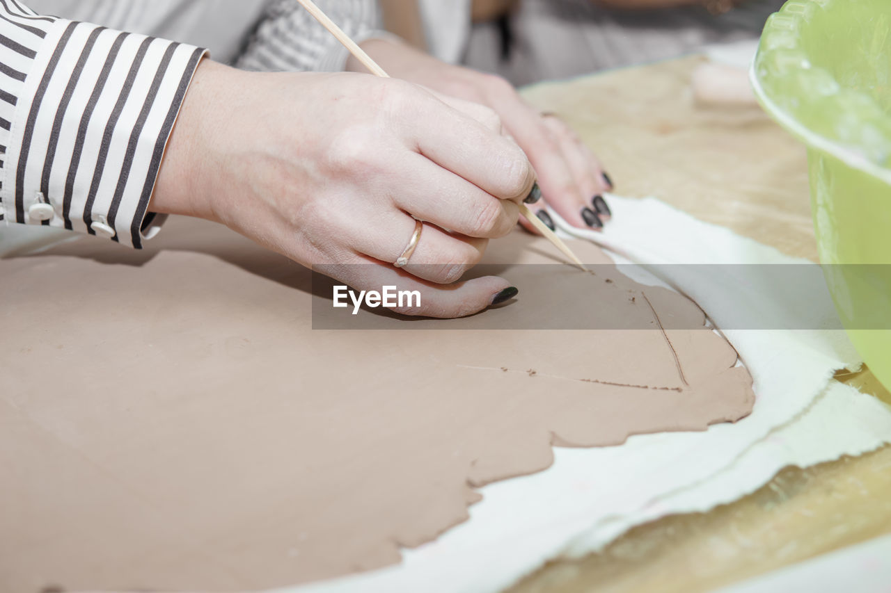 Midsection of woman working on table