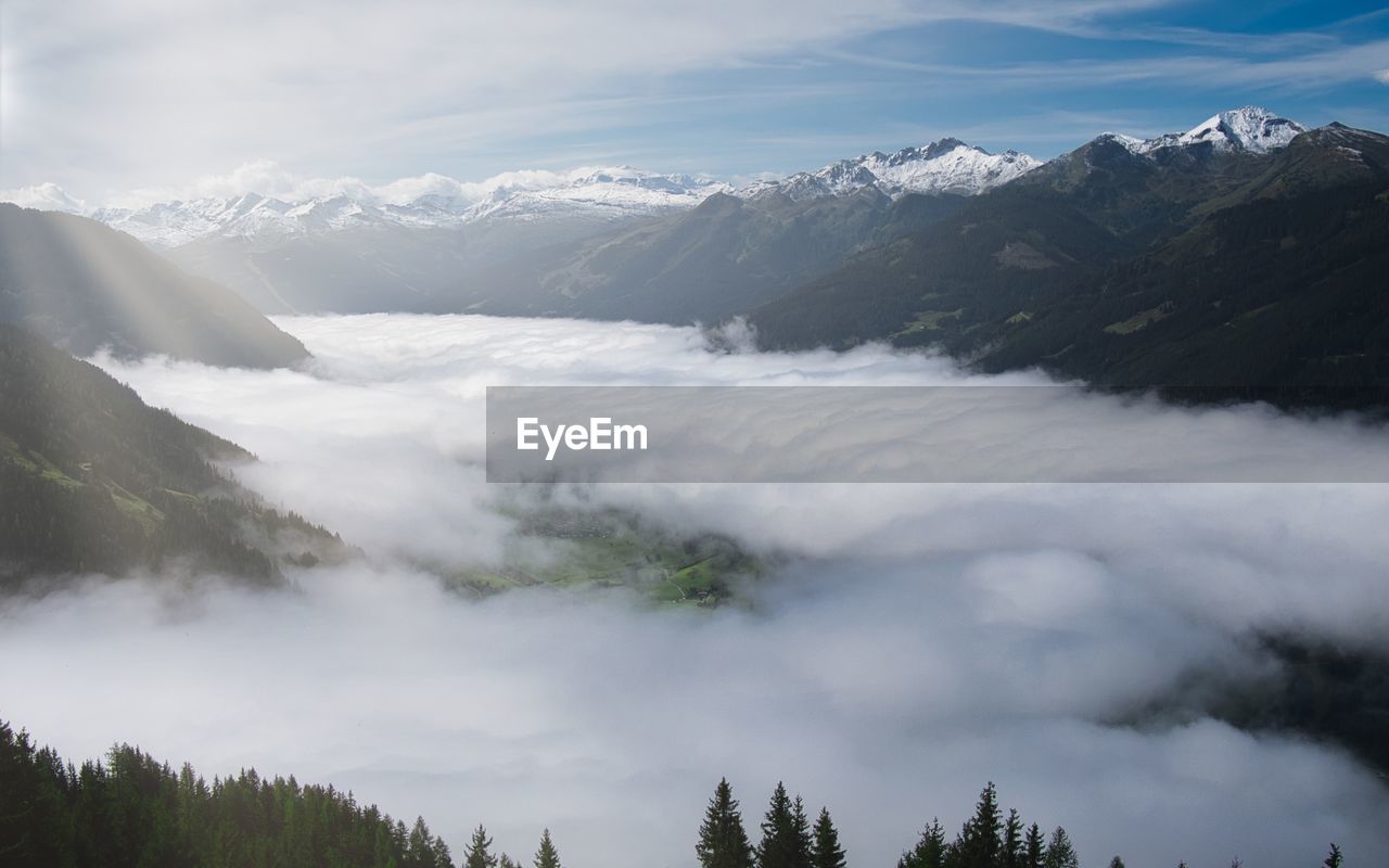 Mountain range austria alps foggy scenic view of snowcapped mountains against sky