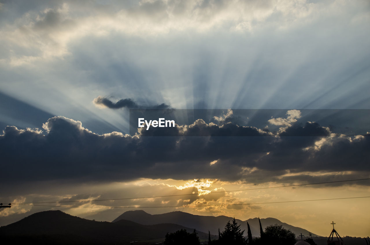 Low angle view of silhouette mountain against sky