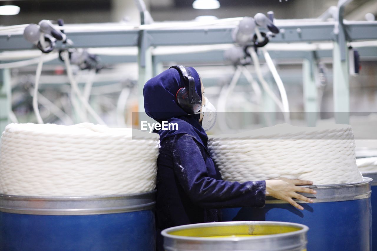 MAN SITTING IN BASKET