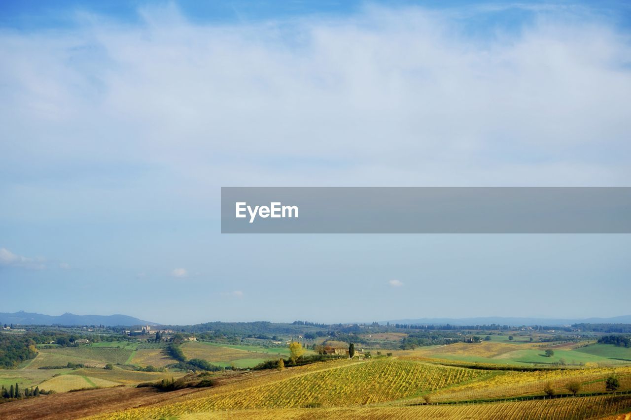 Scenic view of agricultural field against sky - tuscany cauntryside