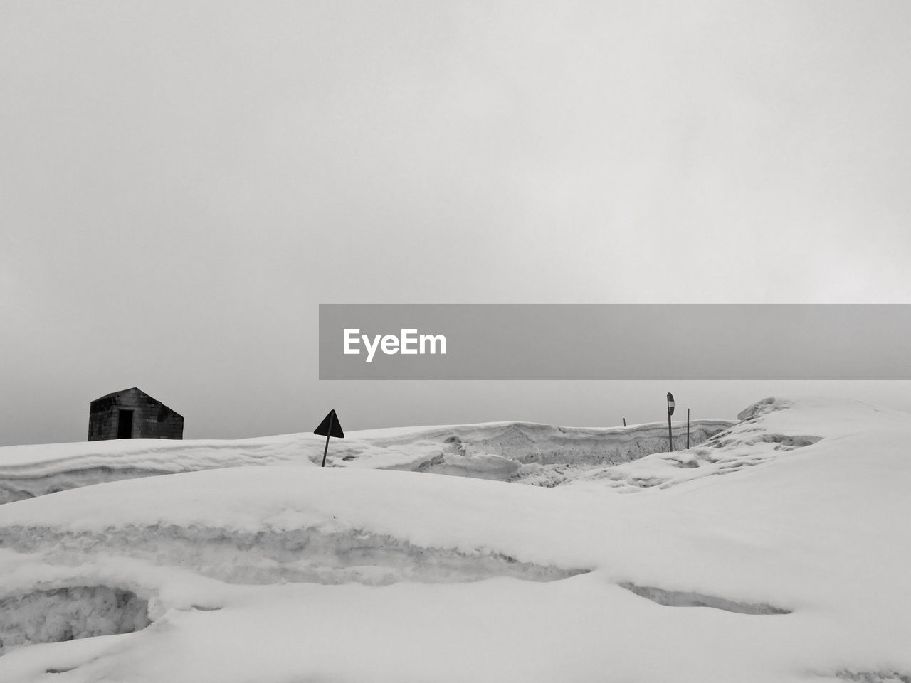 Scenic snowy mountain panorama on a leaden day