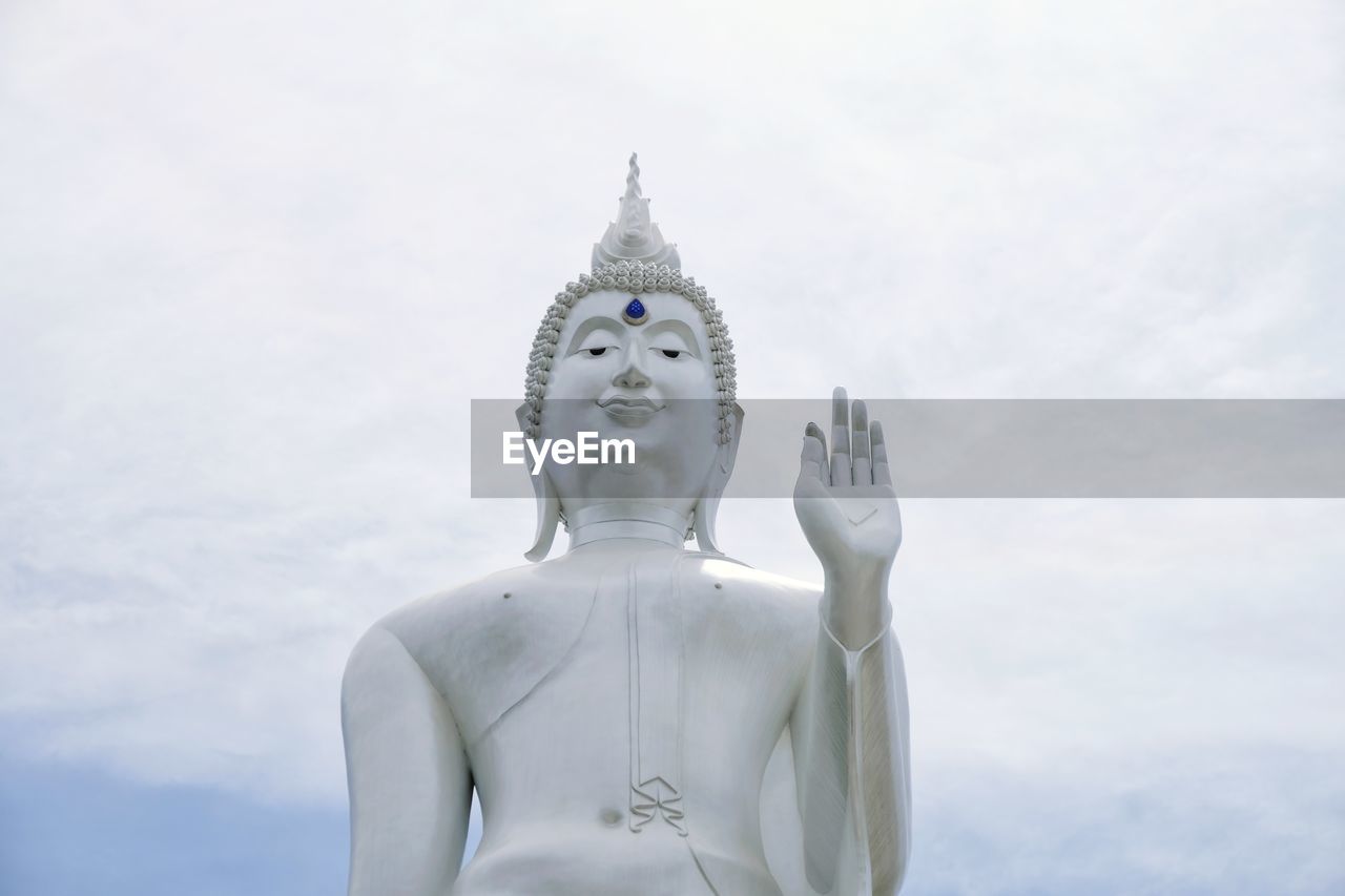 Low angle view of statue against sky